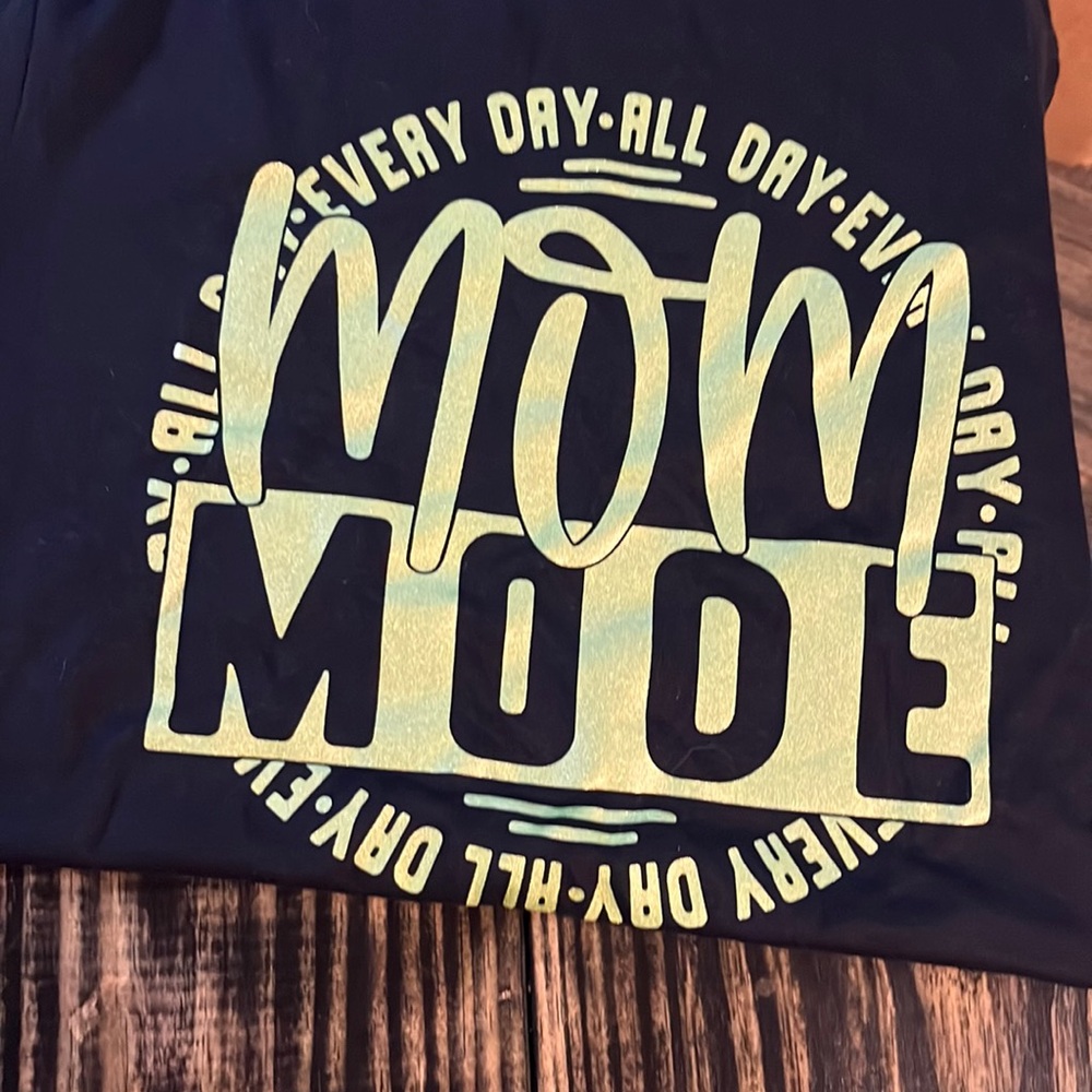 Mom and mini shirts. Mom adult medium, kids adult small.  Never worn